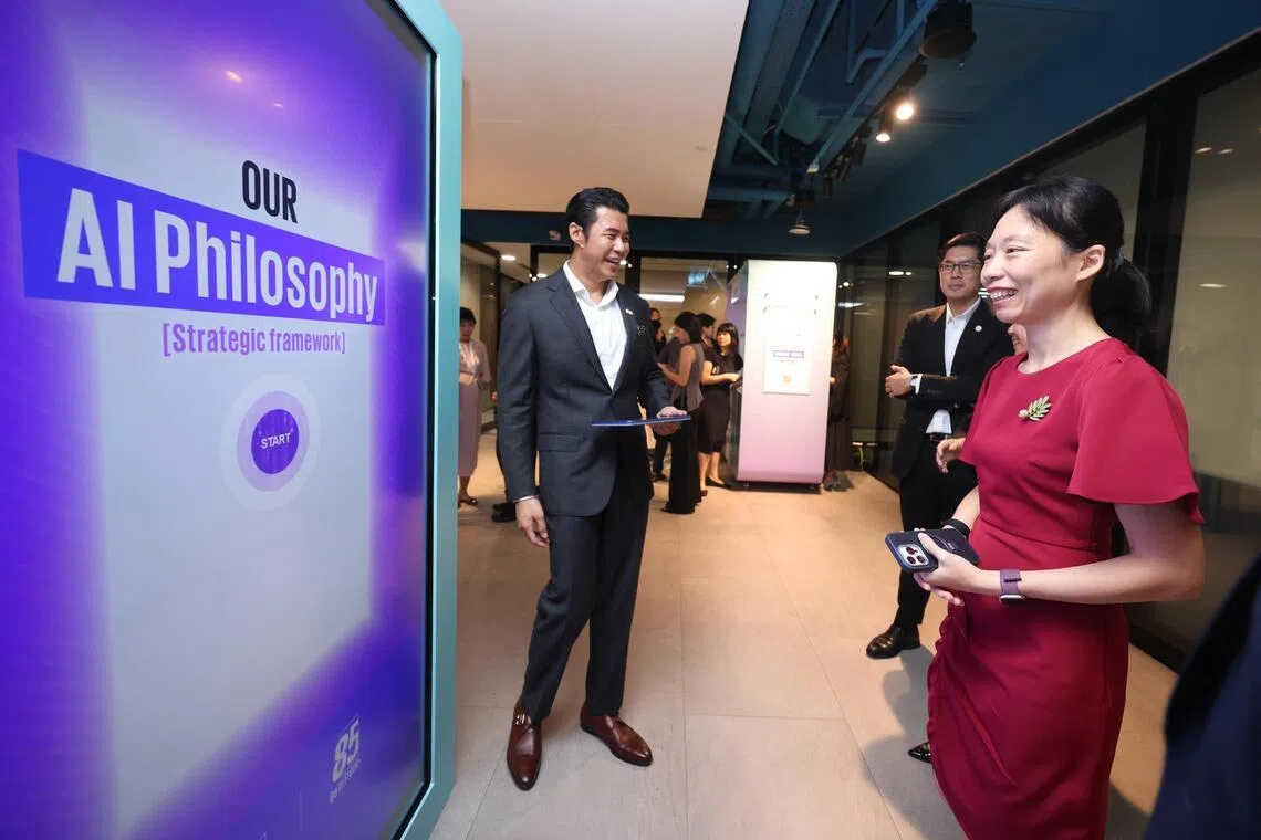 Jasmine Lau, Minister for Digital Development and Information, looks at an interactive board at the launch of the KPMG Trusted AI Center of Excellence on May 25.