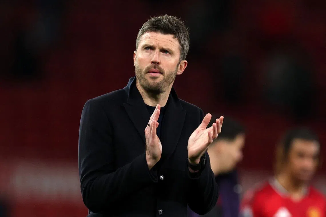 Soccer Football - Premier League - Manchester United v Leeds United - Old Trafford, Manchester, Britain - April 13, 2026 Manchester United manager Michael Carrick applauds fans after the match REUTERS/Phil Noble