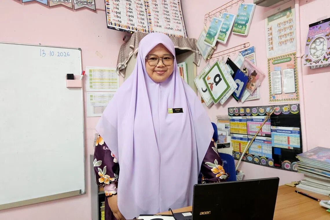 Teacher Nafisah Matli says that doors open an hour at the PAS pre-school in Karambunai before classes begin to accommodate working parents.