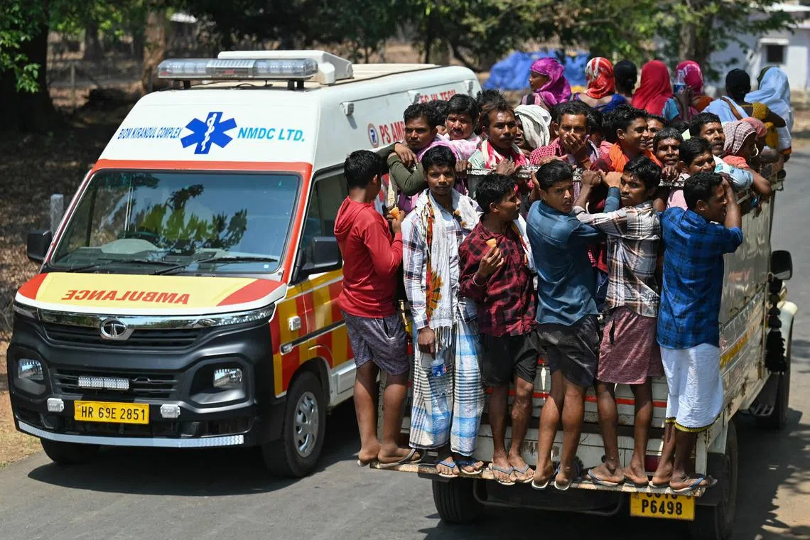 Voters leave on a truck after casting their ballot during the first phase of voting for the India's general election, in Dugeli village of Dantewada district of Chhattisgarh state on April 19, 2024. (Photo by Idrees MOHAMMED / AFP)