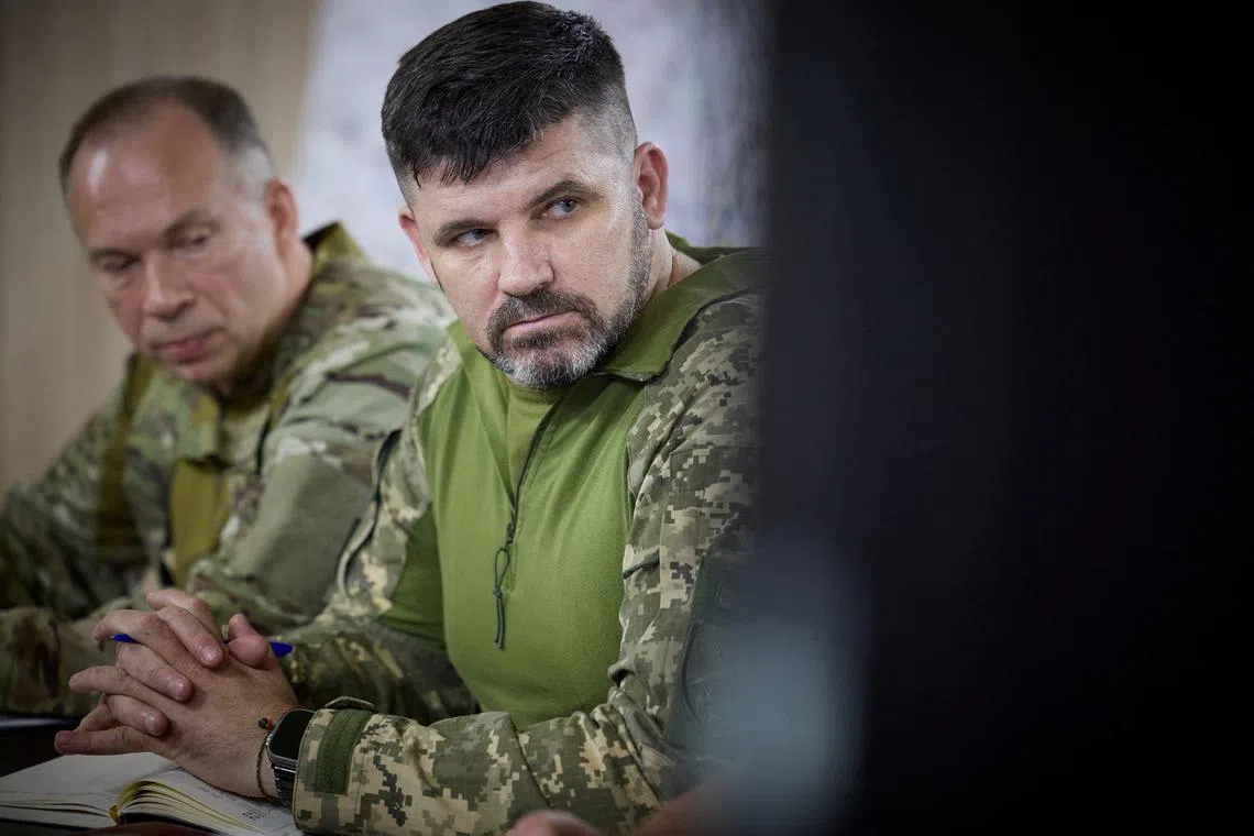 FILE PHOTO: Brigadier-General Andriy Hnatov joint forces commander attends a meeting with Ukraine's President Volodymyr Zelenskiy during his visit to a frontline, amid Russia's attack on Ukraine, near the city of Pokrovsk, Donetsk region, Ukraine June 26, 2024. Ukrainian Presidential Press Service/Handout via REUTERS/File Photo