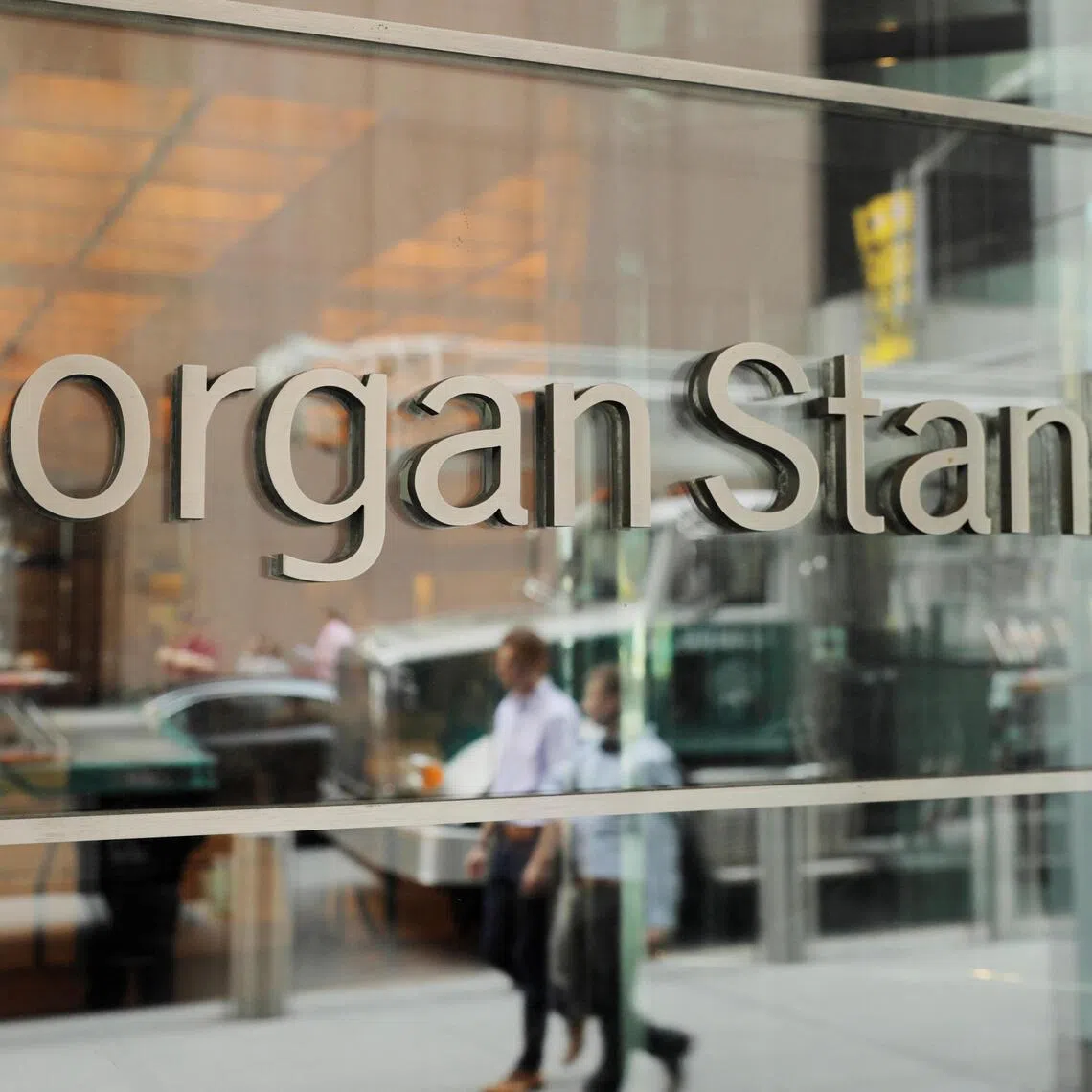 Despite a record year in Asia, Morgan Stanley cautioned against raising bonuses too sharply, aiming to smooth compensation.