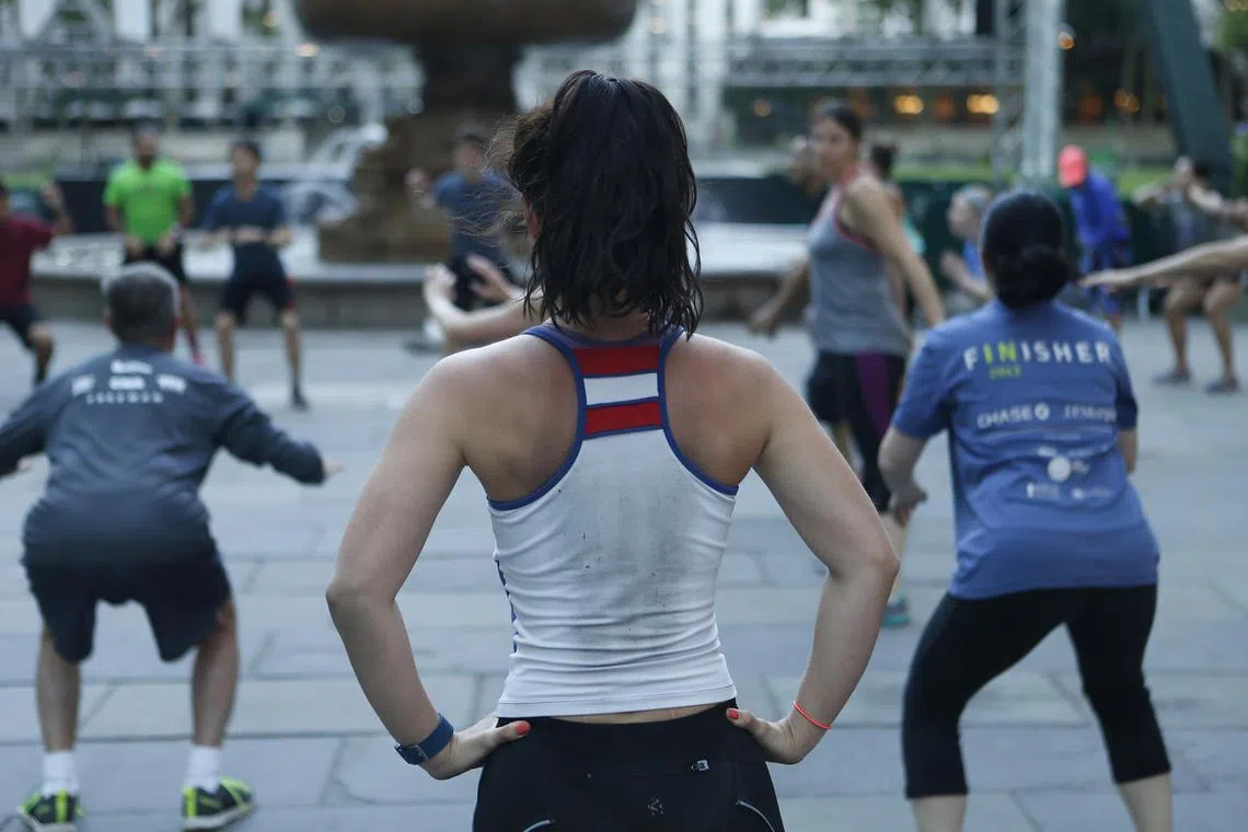 An early morning fitness group exercises in Bryant Park in New York, June 15, 2016. Periods when you stop seeing fitness improvements despite continuing to train are common, said Chris Perrin, a personal trainer and co-owner of Cut Seven, a gym in Washington, D.C.