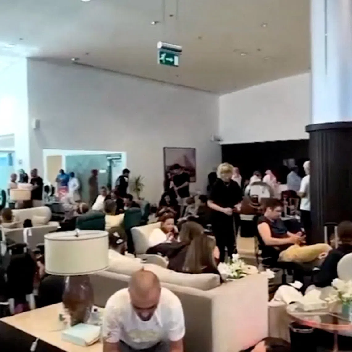 Passengers at Saudi Arabia’s Tabuk airport after a flydubai aircraft bound for Israel was diverted there on Sept 30, due to a cockpit brawl in which the pilot was stabbed.