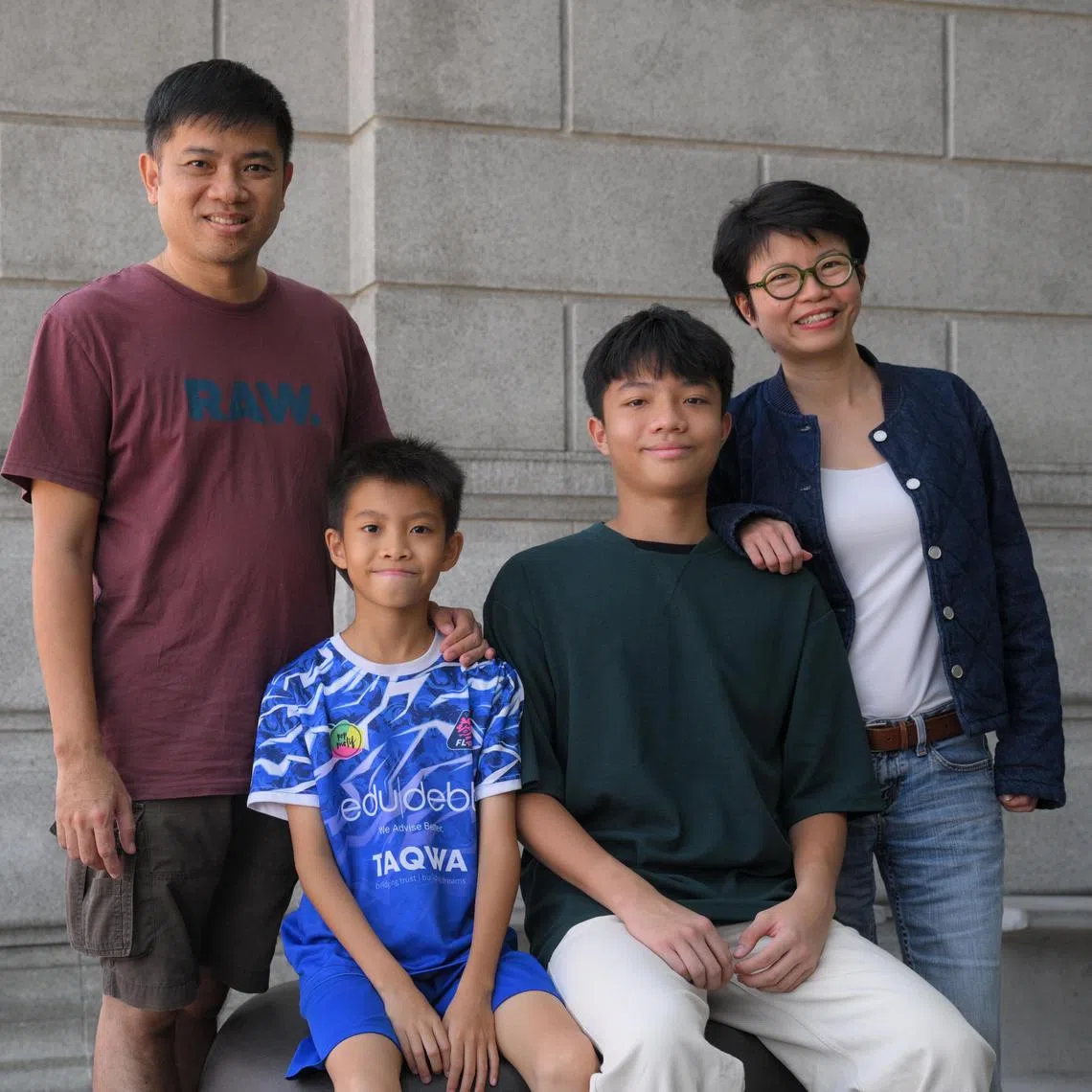 Mr Heleston Chew (left), his wife Kng Mian Tze and their children Ian (second from right) and Ethan (second from left). Ian, who is 15 and was homeschooled, sat the PSLE thrice.  