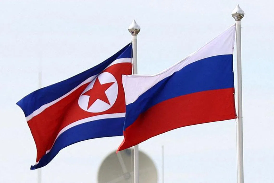 FILE PHOTO: Russian and North Korean flags fly at the Vostochny Сosmodrome, the venue of the meeting between Russia's President Vladimir Putin and North Korea's leader Kim Jong Un, in the far eastern Amur region, Russia, September 13, 2023. Sputnik/Artem Geodakyan/Pool via REUTERS/File Photo