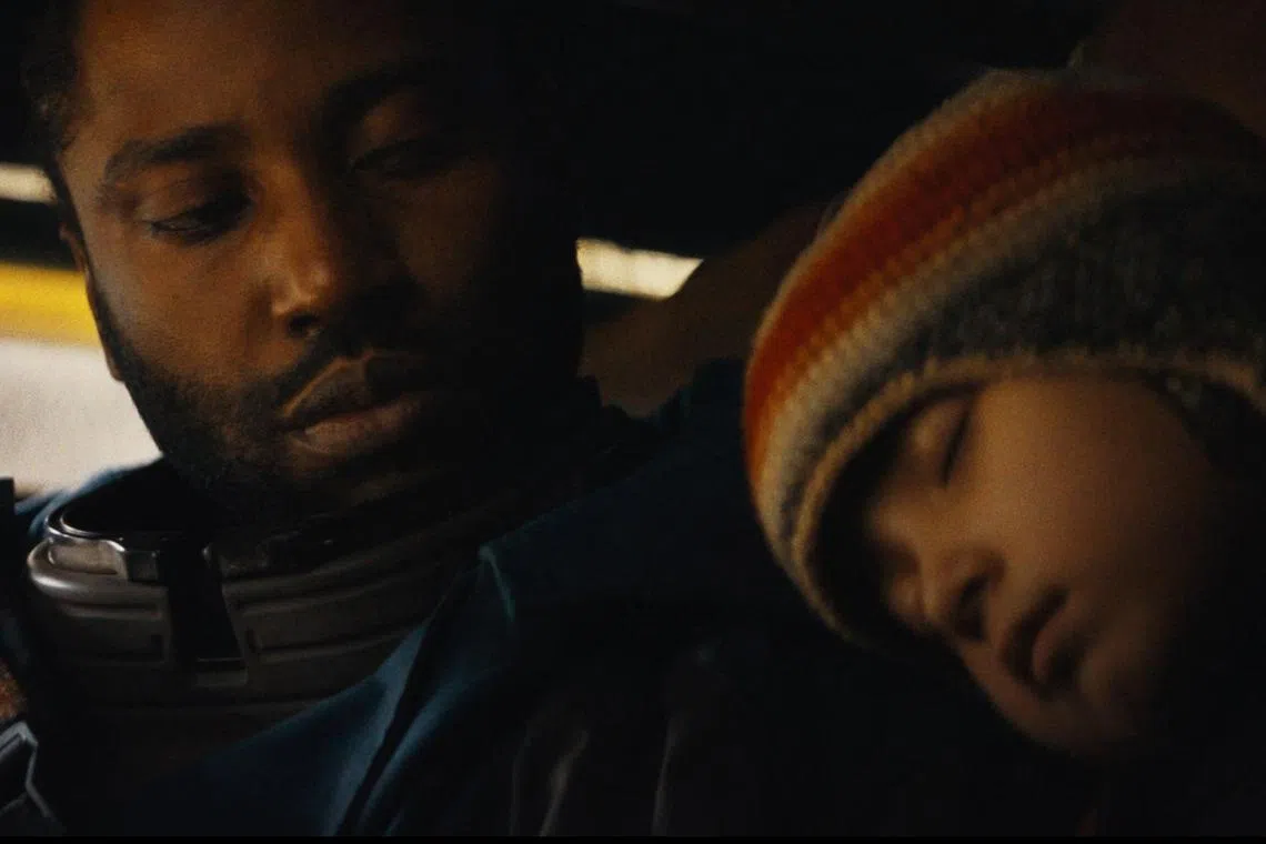 The Creator stars John David Washington (left) as Joshua, a human who meets the robot Alphie played by Madeleine Yuna Voyles.