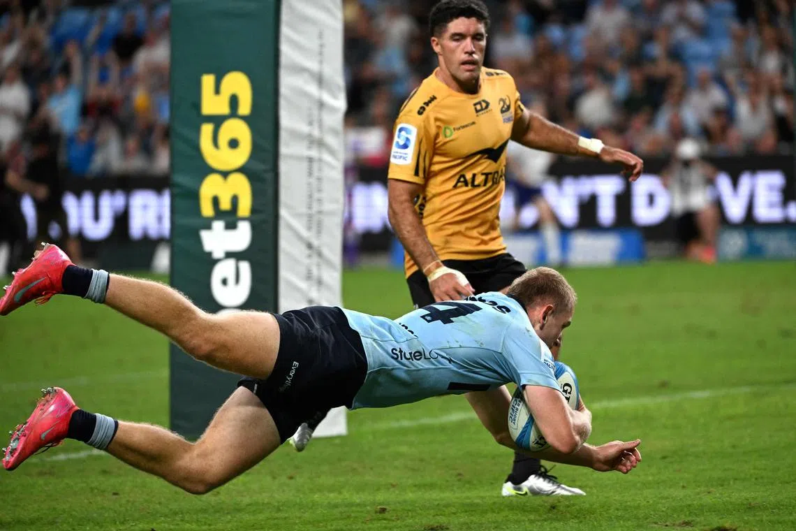 New South Wales Waratahs' Max Jorgensen scores a try in the Super Rugby Pacific Round 4 match against Western Force at the Allianz Stadium in Sydney on March 8, 2025.