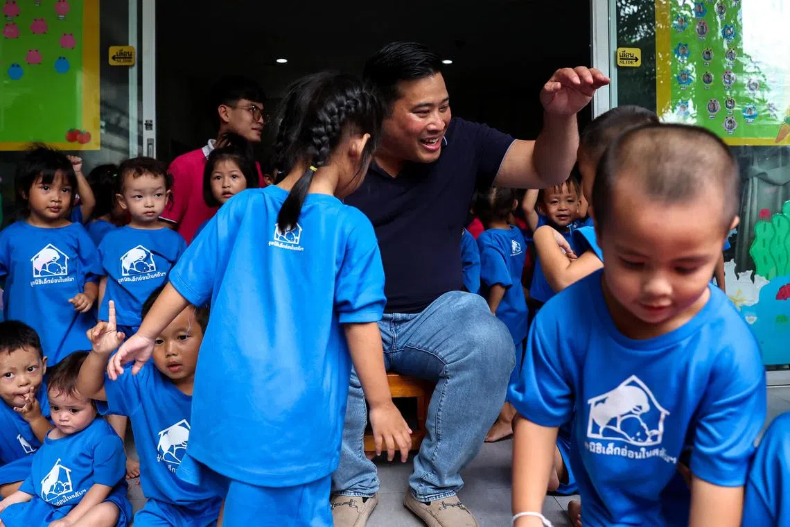 Mr Vacharaesorn Vivacharawongse (centre) visiting the Foundation for Slum Child Care, which is supported by the Royal Family, in Bangkok on Aug 8, 2023.