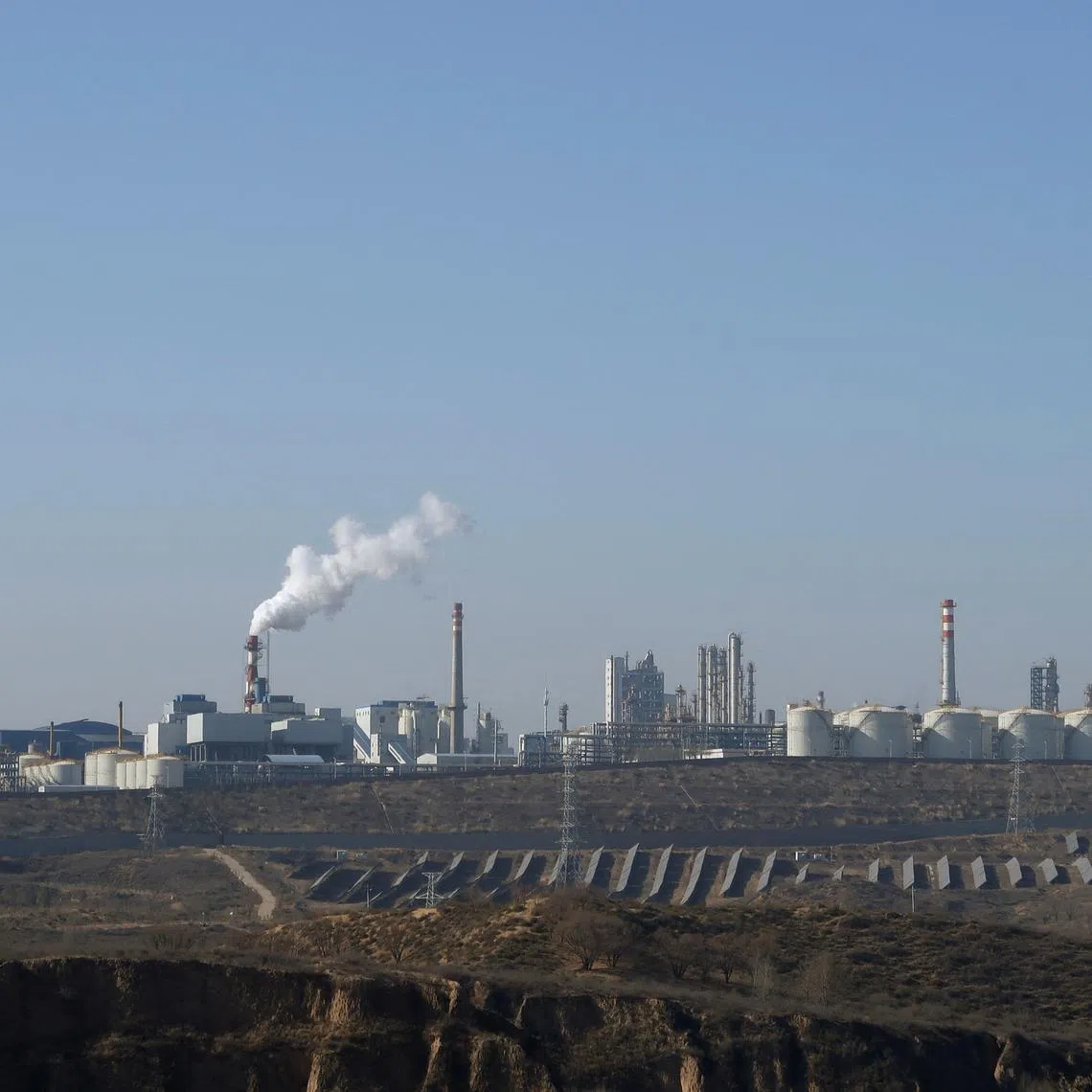 FILE PHOTO: Solar panels lie in front of factories at Jinjie Industrial Park in Shenmu, Shaanxi province, China November 20, 2023. REUTERS/Colleen Howe/File Photo