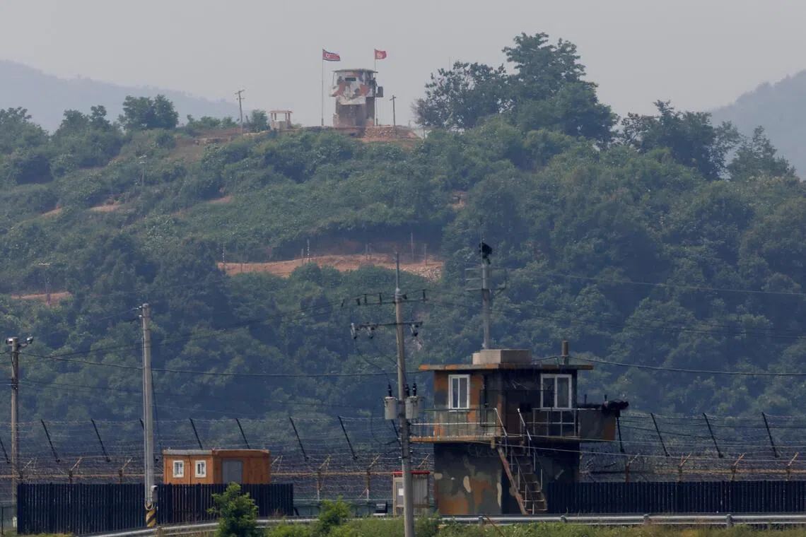 A North Korean soldier stands guard at his guard post inside North Korean territory, in this picture taken from Paju, South Korea, near the demilitarized zone separating the two Koreas, June 17, 2020. 