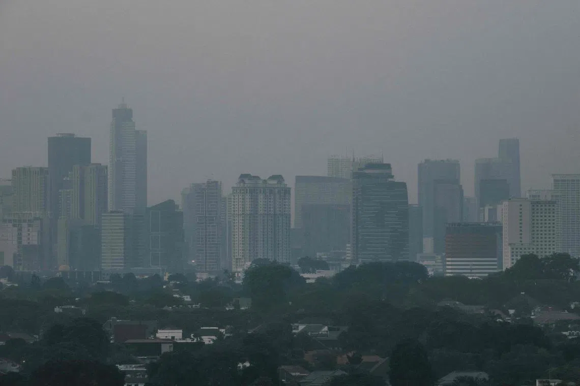 Buildings shrouded in haze in Jakarta on Aug 23. Singapore may soon face hazy conditions, amid an increase in hot spots in Sumatra.