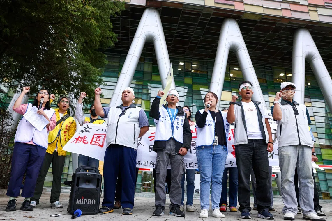 Union representatives and members demanding greater profit shares and better bonuses outside Micron Technology’s building in Taoyuan on Oct 22.