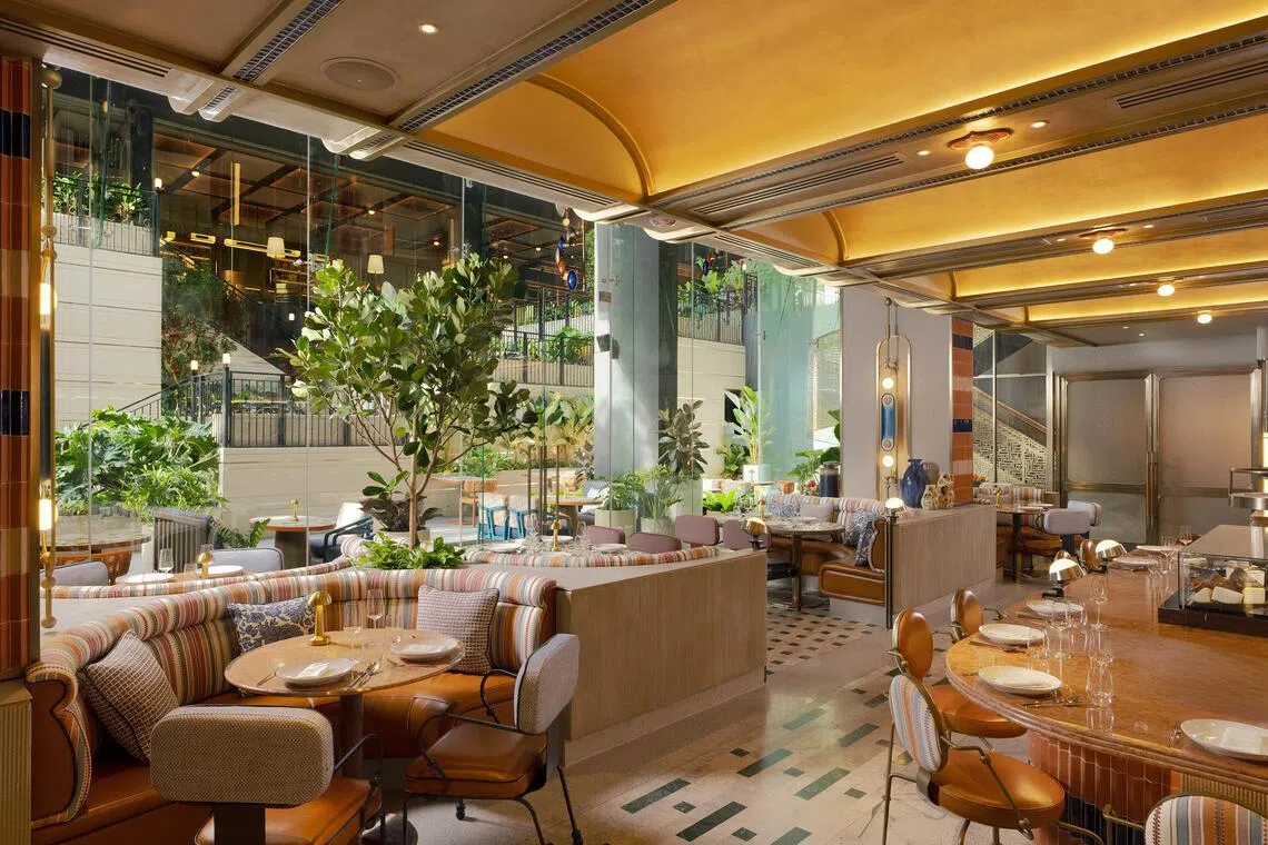 Mosaic table tops and azulejo tiles bring a serene sense of place to Cante inside Canopy Bangkok Sukhumvit.