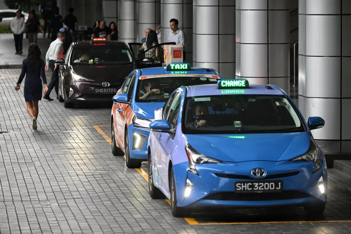 ST20230220_202368590837 Kua Chee Siong/ pixgeneric/ Generic pix of ComfortDelGro taxis (blue) and an Strides taxi (maroon) seen at the taxi stand at International Plaza on Feb 20, 2023.