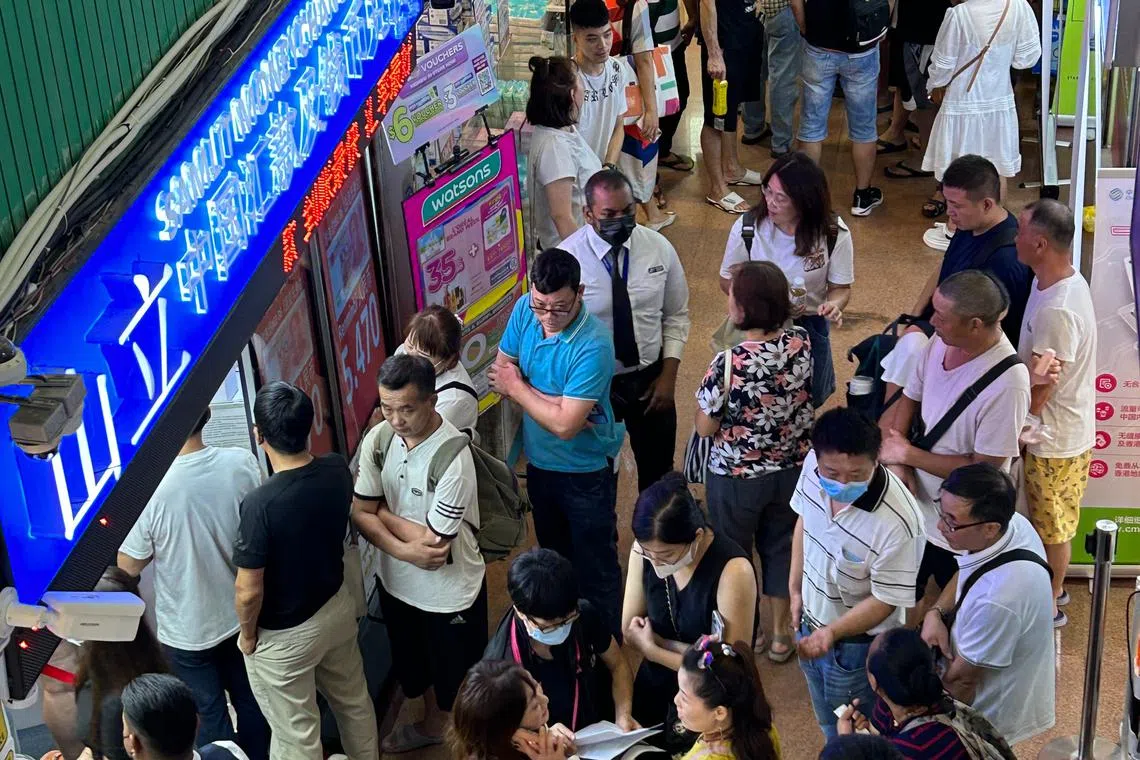 Three Chinese nationals working in Singapore sued a remittance firm after police in the mainland froze money they had transferred home.