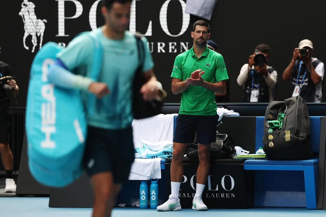 Novak Djokovic respectfully applauds his rival Lorenzo Musetti who had to retire during their quarter-final match at the Australian Open. 