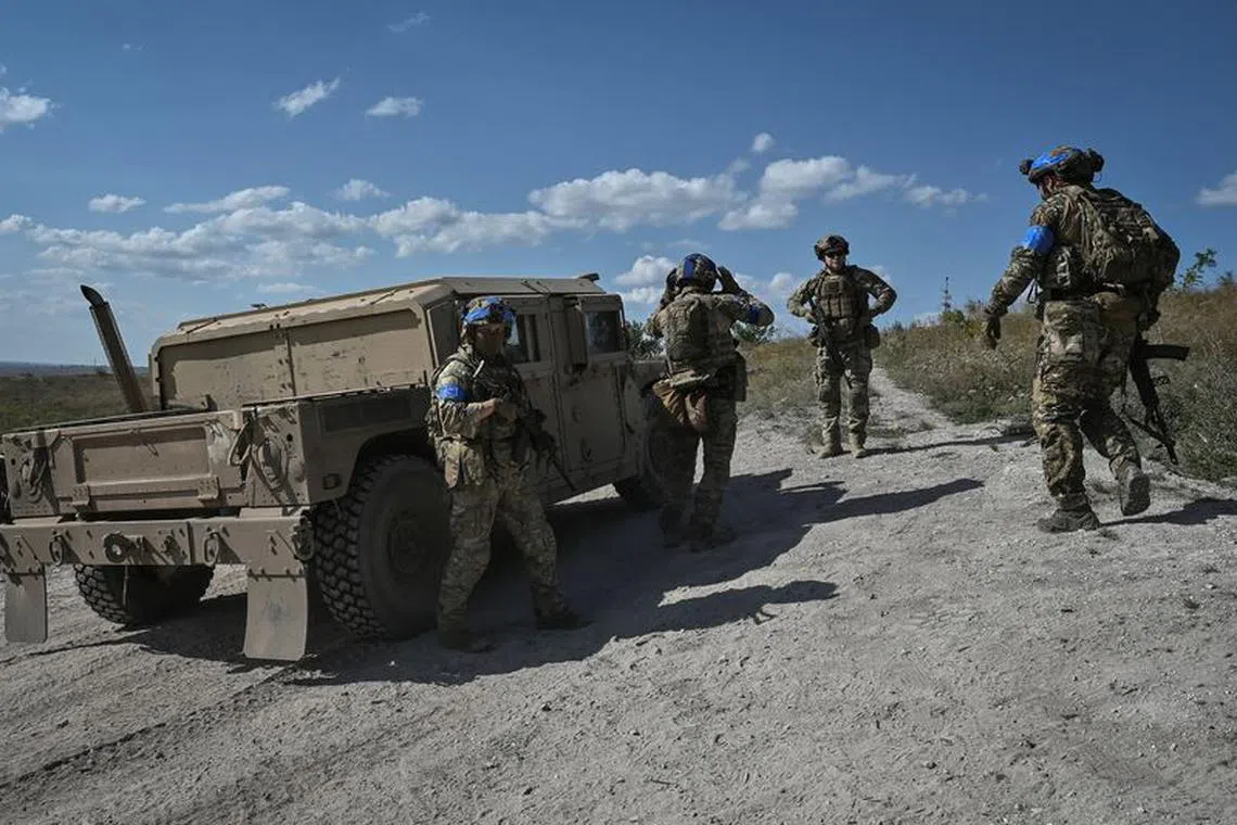 FILE PHOTO: Servicemen of Ukraine's 3rd Separate Assault Brigade prepare to conduct a reconnaissance mission, amid Russia's attack on Ukraine, near Bakhmut, Ukraine September 7, 2023. REUTERS/Stringer