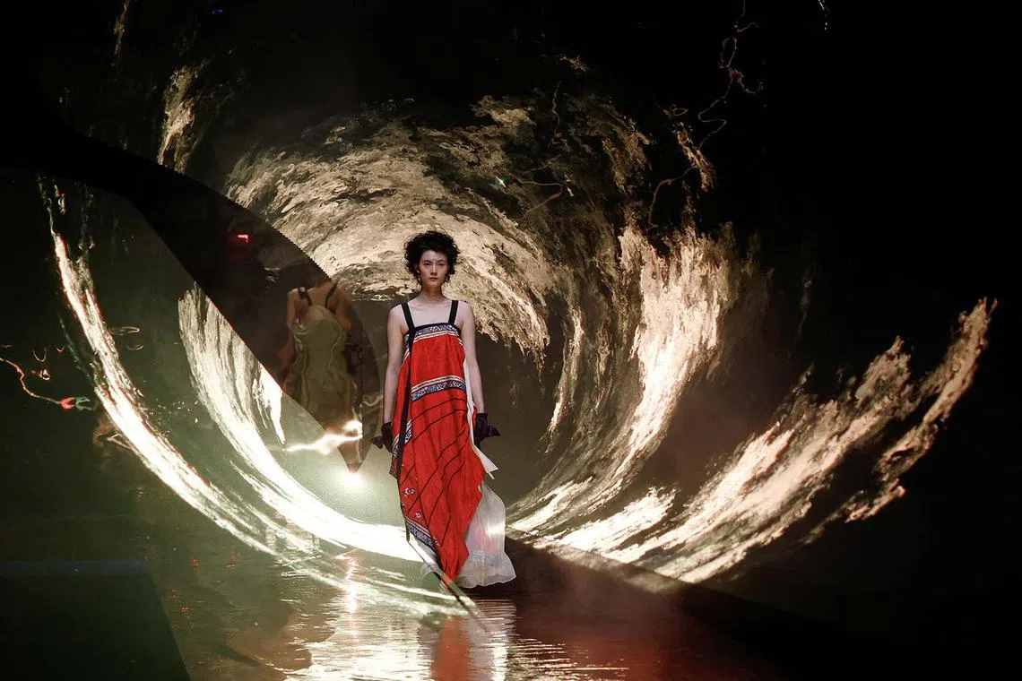 A model presents a creation at the A Life On The Left show by Qi Lin, during China Fashion Week in Beijing, China, on Sept 10.