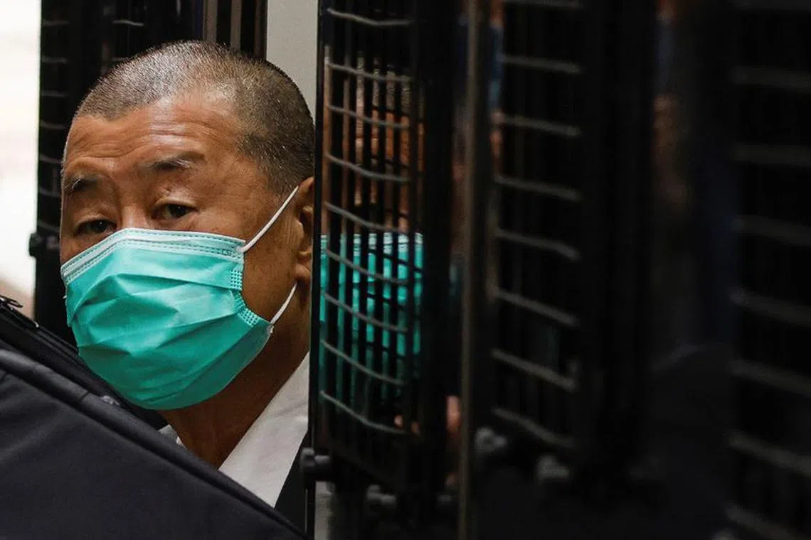 FILE PHOTO: Media mogul Jimmy Lai, founder of Apple Daily, arrives the Court of Final Appeal by prison van in Hong Kong, China February 9, 2021. REUTERS/Tyrone Siu