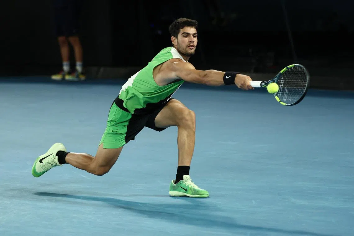 Tennis - Australian Open - Melbourne Park, Melbourne, Australia - January 27, 2026 Spain's Carlos Alcaraz in action during his quarter final match against Australia's Alex De Minaur REUTERS/Tingshu Wang