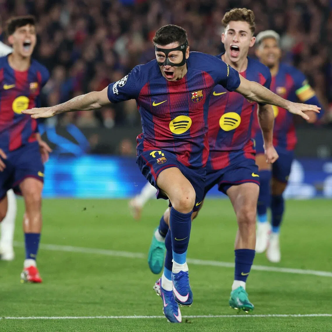 Barcelona's Robert Lewandowski celebrates scoring his team's fifth goal against Newcastle United on March 18.