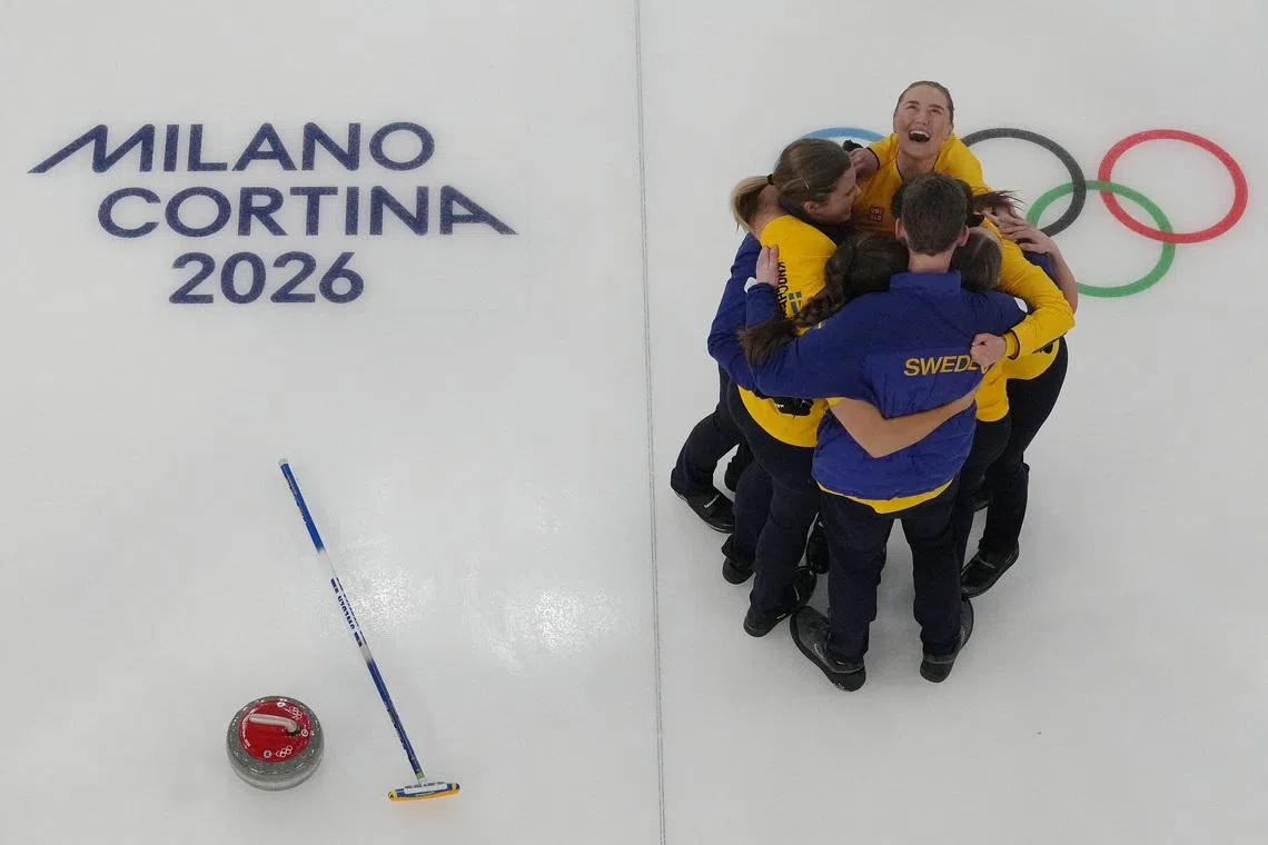 Milano Cortina 2026 Olympics - Curling - Women's Semi-final - Canada vs Sweden - Cortina Curling Olympic Stadium, Cortina d'Ampezzo, Italy - February 20, 2026. Team Sweden celebrates after winning the match against Canada REUTERS/Issei Kato