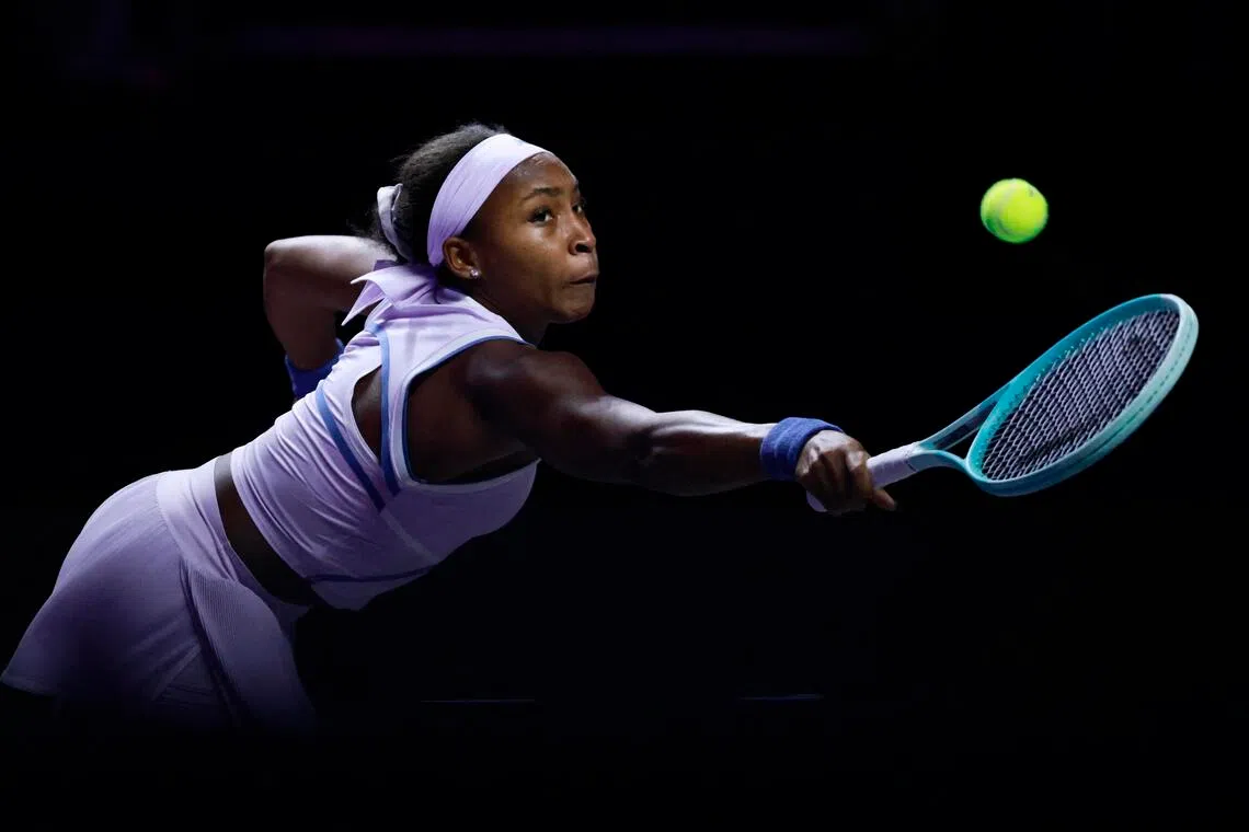Coco Gauff of the US in action during her 6-3, 6-2 WTA Finals group-stage win over Italy's Jasmine Paolini at King Saud University Indoor Arena in Riyadh on Nov 4, 2025.