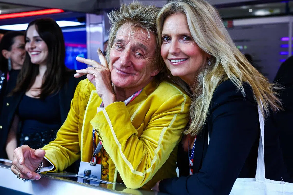 British singer Rod Stewart and his wife Penny Lancaster at the Red Bull Racing garage, ahead of the Formula One Grand Prix of Las Vegas, in Nevada in November 2023.  Five shows on the Asian leg of his world tour have been cancelled. 