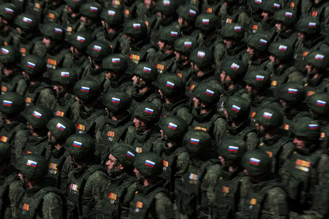 Russian soldiers, who were involved in the country's military campaign in Ukraine, march in columns during a parade on Victory Day, marking the 80th anniversary of the victory over Nazi Germany in World War Two, in Red Square in central Moscow, Russia, May 9, 2025. REUTERS/Anton Vaganov