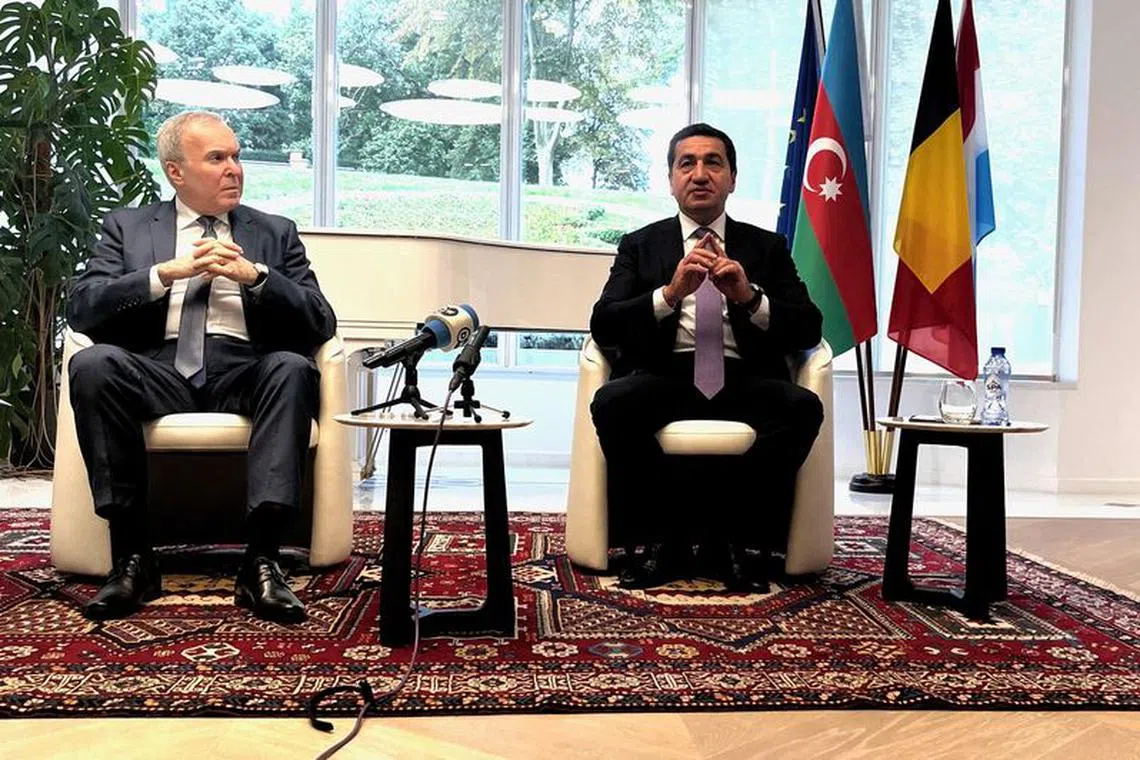 Hikmet Hajiyev, foreign policy adviser to Azerbaijan's President Ilham Aliyev and Vaqif Sadiqov, Ambassador of the Republic of Azerbaijan to Belgium and Luxembourg and Head of Mission to EU talk to reporters in Brussels, Belgium September 26, 2023.  REUTERS/Bart Biesemans/File Photo