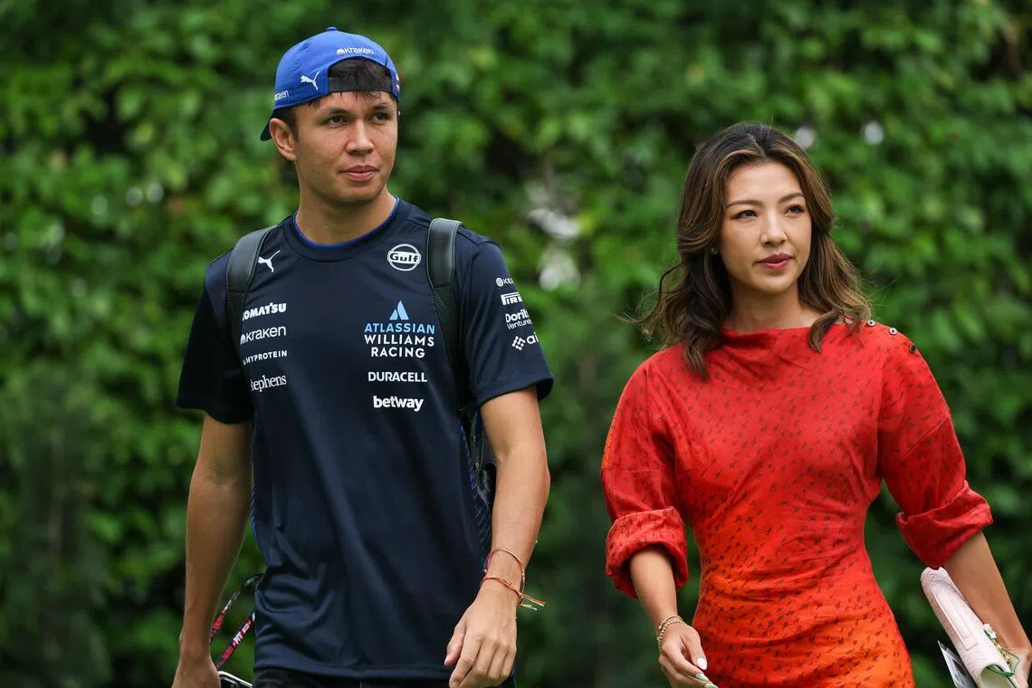 Williams’ racer Alex Albon and his girlfriend, professional golfer Lily Muni He, seen at the F1 Paddock ahead of a practice drive on Oct 3, 2025.