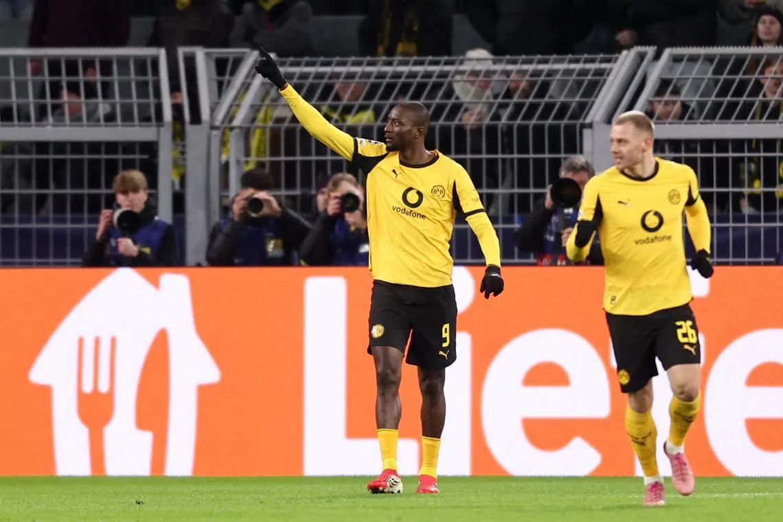 Soccer Football - UEFA Champions League - Play Off - First Leg - Borussia Dortmund v Atalanta - Signal Iduna Park, Dortmund, Germany - February 17, 2026 Borussia Dortmund's Serhou Guirassy celebrates scoring their first goal REUTERS/Leon Kuegeler