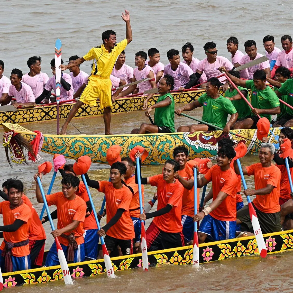 Participants row dragon boats during a competition as part of the Water Festival on the Tonle Sap river in Phnom Penh on Nov 26.