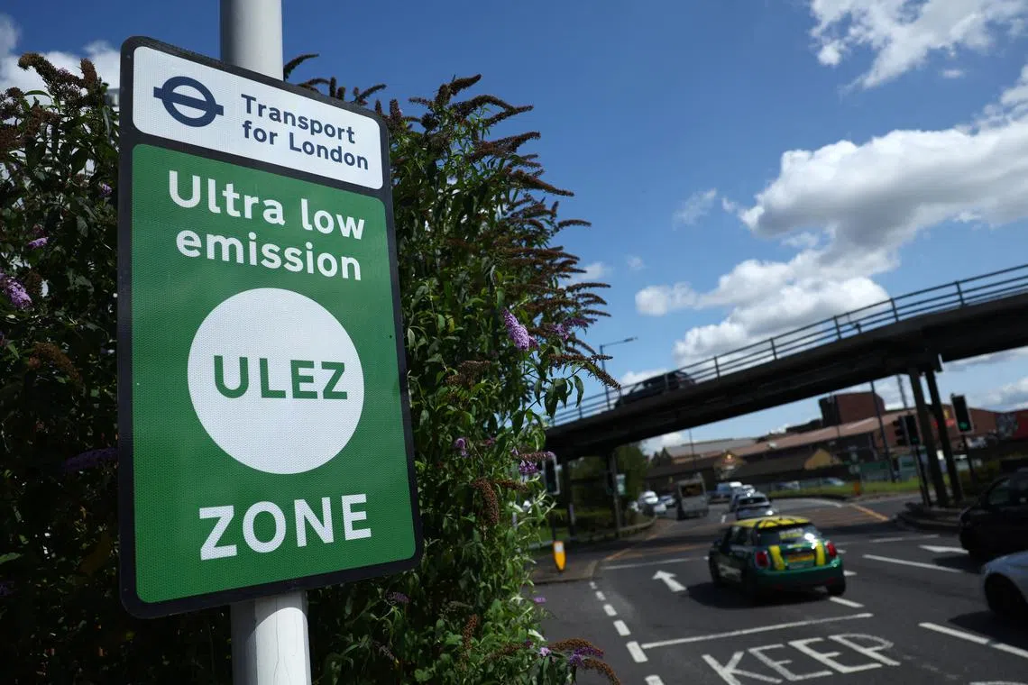 FILE PHOTO: Signage is seen along the existing boundary of London's Ultra Low Emissions Zone (ULEZ) zone ahead of proposed upcoming expansion, in London, Britain, August 22, 2023. REUTERS/Toby Melville/File Photo