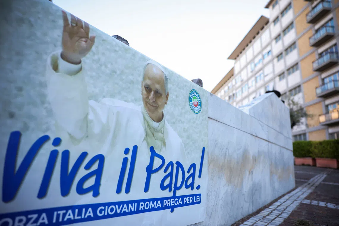 A poster reading “Long live the Pope!” outside Gemelli Hospital where he underwent surgery.