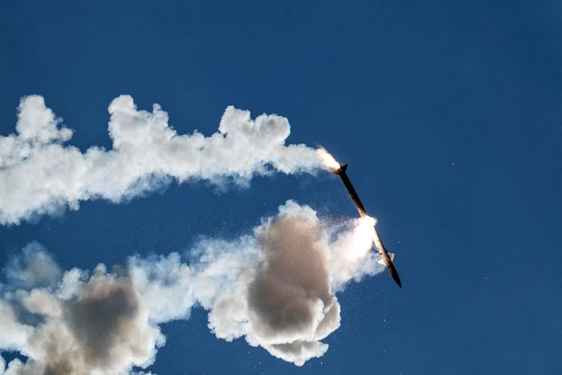 A faulty interceptor missile launched by Israel’s Iron Dome anti-missile system disintegrates above southern Lebanon.