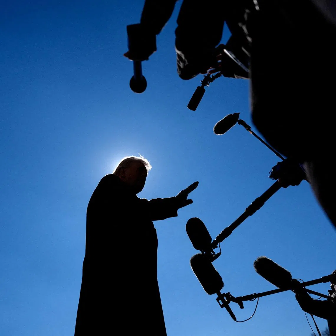 U.S. President Donald Trump speaks with the press before departing from the South Lawn at the White House in Washington, D.C., U.S., February 13, 2026. REUTERS/Kent Nishimura