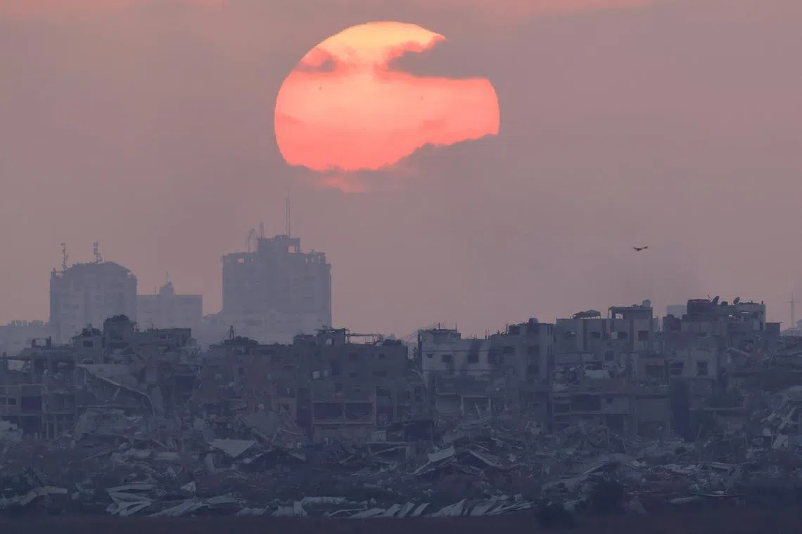 FILE PHOTO: The sun sets over Gaza, amid the Israel-Hamas conflict, as seen from Israel, June 27, 2024. REUTERS/Amir Cohen/File Photo