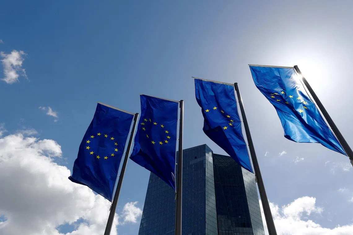 FILE PHOTO: European Union flags flutter outside the European Central Bank headquarters in Frankfurt, Germany, April 26, 2018. REUTERS/Kai Pfaffenbach/File Photo