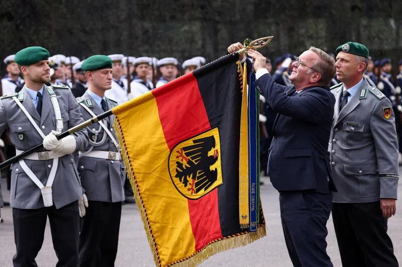 German Defence Minister Boris Pistorius, seen here visiting the Guard Battalion in Berlin on July 15, is in charge of a growing military.