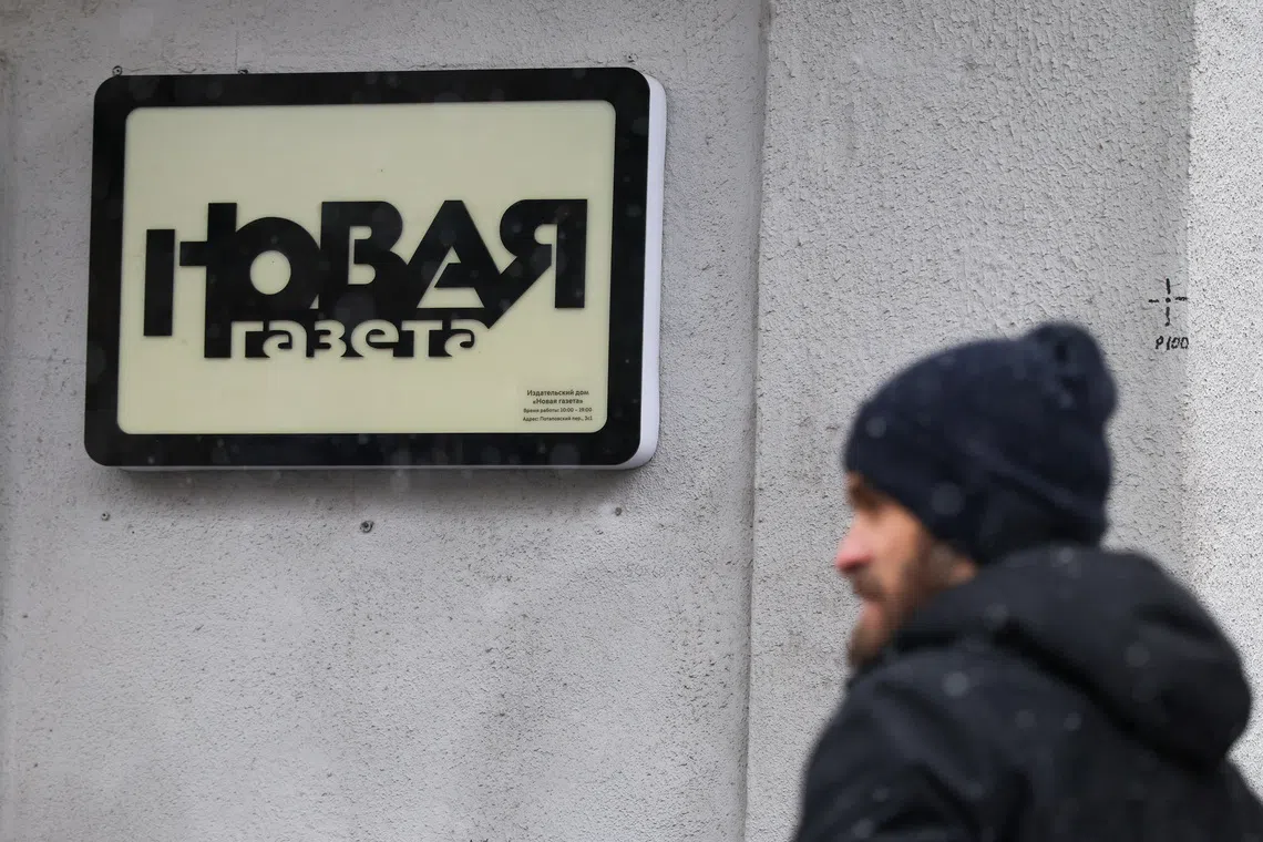 A man stands outside the office of the independent Russian newspaper Novaya Gazeta during a reported search by security services as part of an unspecified investigation, in Moscow, Russia, April 9, 2026. REUTERS/Ramil Sitdikov