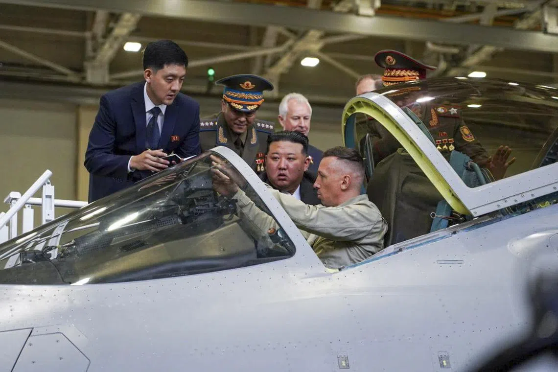 North Korean leader Kim Jong Un (centre) visiting a Russian aircraft plant that builds fighter jets in Komsomolsk-on-Amur, Russia, on Sept 15, 2023.