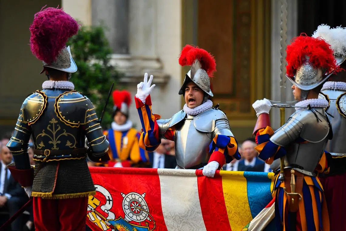 A recruit taking his oath during the swearing-in ceremony for new recruits of the Pontifical Swiss Guard during a ceremony at the San Damaso courtyard on May 6, 2023 in The Vatican. 