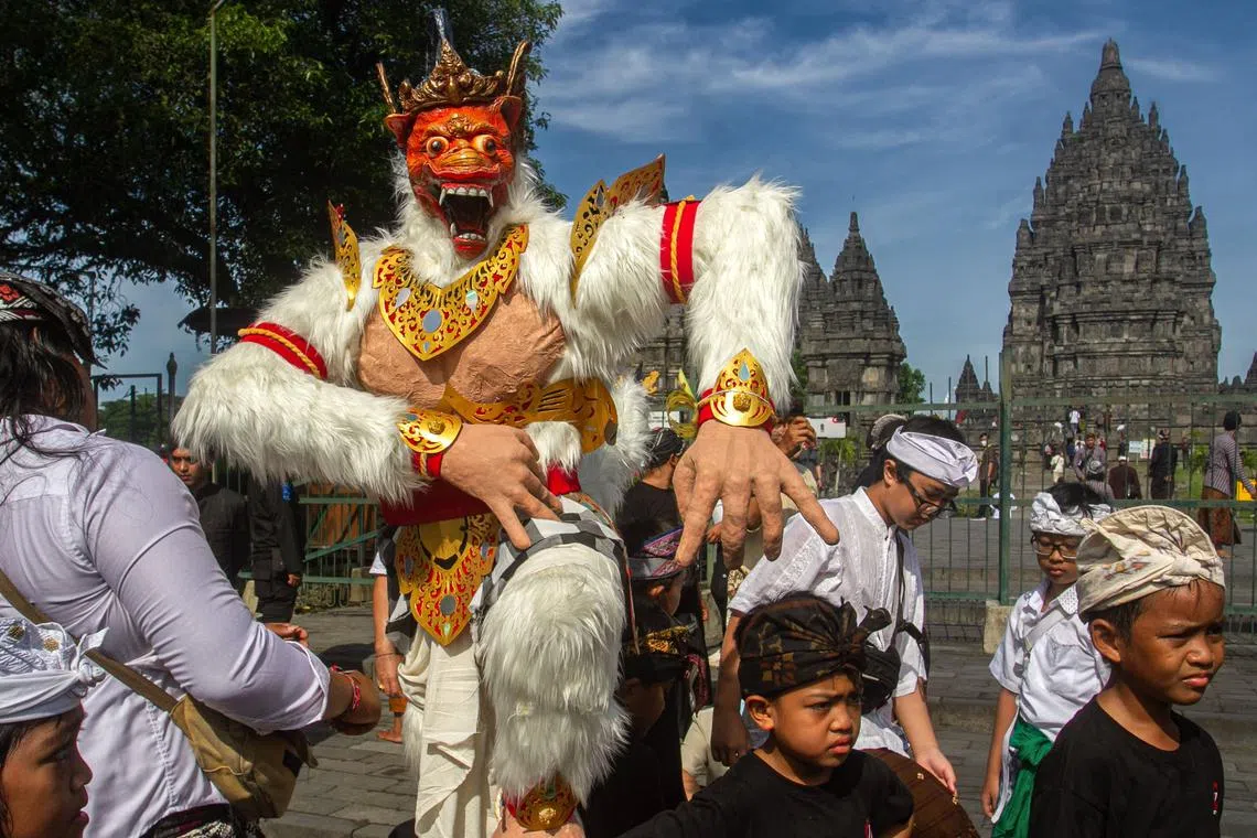 Devotees display an effigy known as Ogoh-Ogoh during a ceremony at the Prambanan temple in Sleman, Bali, on March 21, 2023, a day before the 'Day of Silence' - locally known as Nyepi - when Hindus do not work, travel or take part in any indulgence. 
