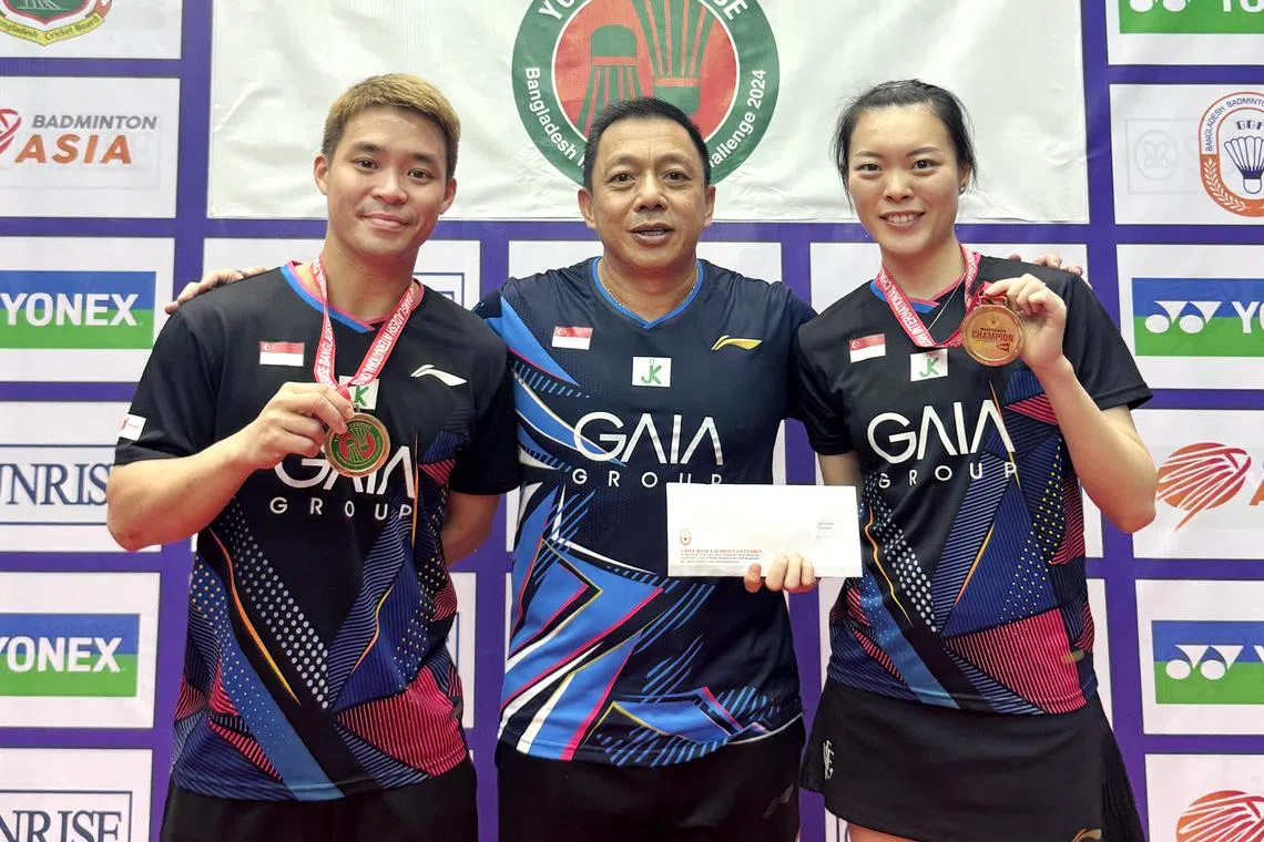 (From left) Singapore Badminton's Terry Hee, National doubles head coach Paulus Firman and Jin Yujia at the Bangladesh International Open on Dec 21.