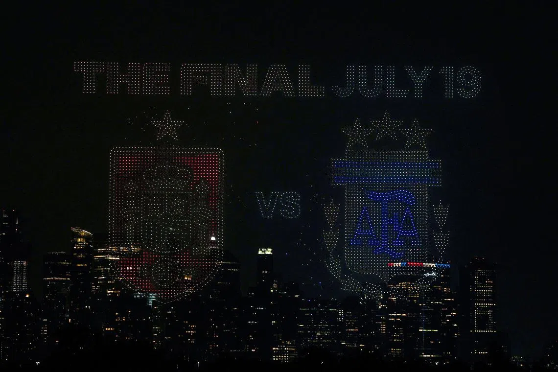 Jul 15, 2026; Jersey City, New Jersey, USA; A general view of a drone show above Liberty State Park with the New York City skyline in the background ahead of the FIFA World Cup 2026 Final between Spain and Argentina. Mandatory Credit: Vincent Carchietta-Imagn Images