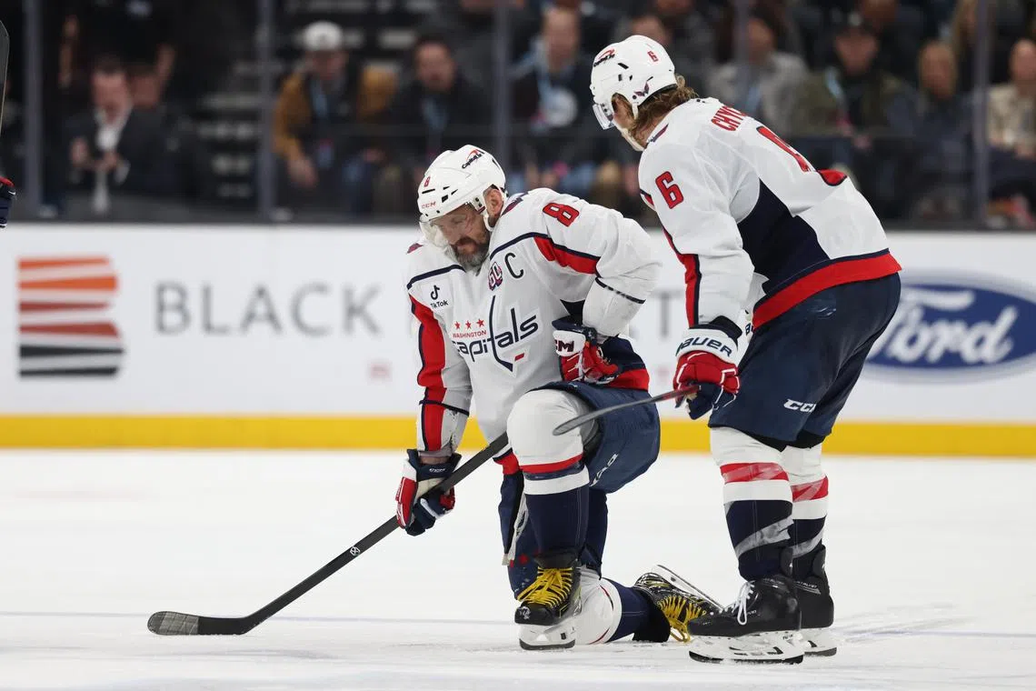 Nov 18, 2024; Salt Lake City, Utah, USA; Washington Capitals left wing Alex Ovechkin (8) is injured on a play against the Utah Hockey Club during the third period at Delta Center. Mandatory Credit: Rob Gray-Imagn Images/ File Photo