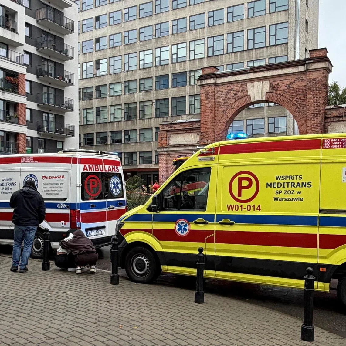 Ambulances waiting outside a further education college in Warsaw, Poland, on Oct 10, following a knife attack. The attacker was said to be a 21-year-old student of the college.
