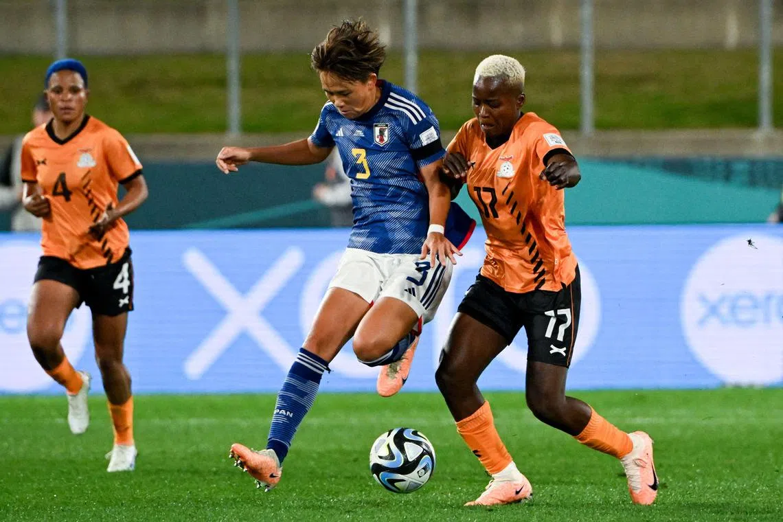 Japan's defender Moeka Minami and Zambia's forward Racheal Kundananji fighting for the ball during the Australia and New Zealand 2023 Women's World Cup Group C football match which Japan won 5-0.
